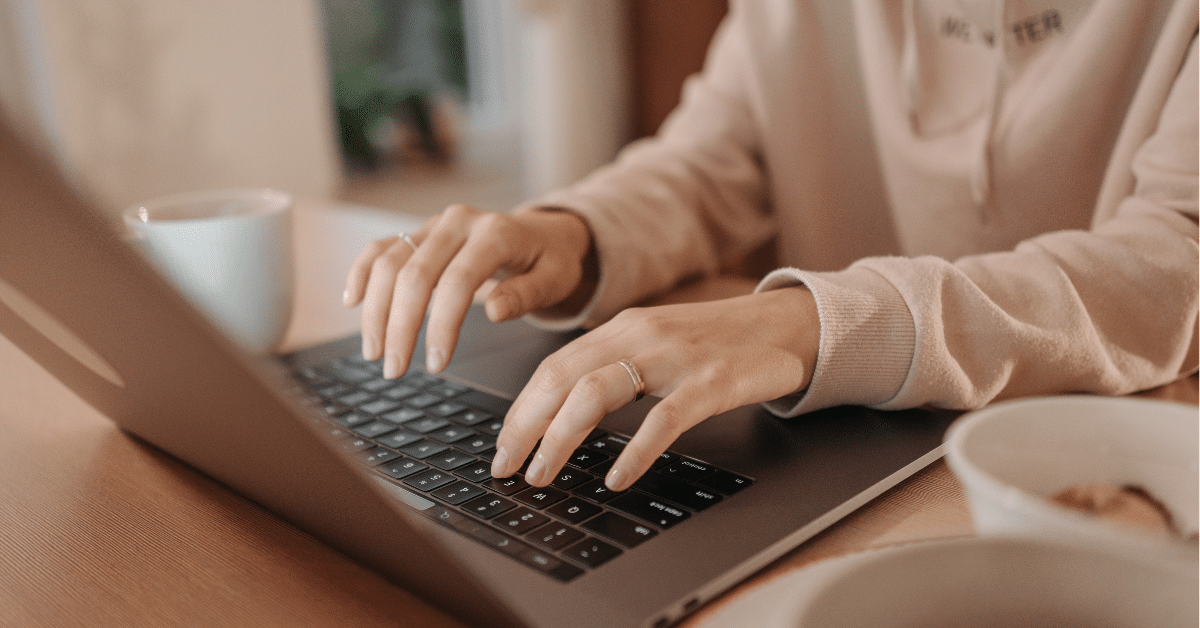 Person typing on laptop